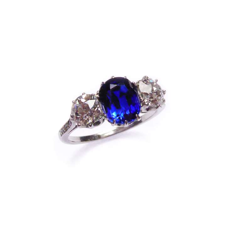 Art Deco sapphire and diamond three stone ring, centred by a cushion cut Ceylon sapphire,